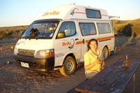 Nikki enjoying a beer by our van at Tulki Beach Campsite, Cape Range National Park