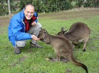 Ian feeding kangaroos at Pandana Wildlife Park, Kangaroo Island