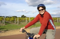 Nikki cycling through vineyards, Margaret River