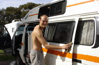 Ian washing the van in Midland Caravan Park, Perth