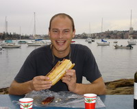 Ian tucks into a bbq'd sausage baguette on the Manly Scenic Walkway, Sydney