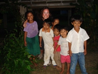 Nikki with some of the children of the families at Tutzil Nah cottages