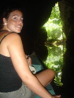 Nikki in boat by exit to Barton Creek Caves