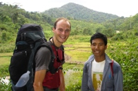 Ian & Xay walking past the rice fields, Ban Nam Lai Trek
