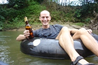 Ian floating with beer in hand, Nam Sok River, Vang Vieng