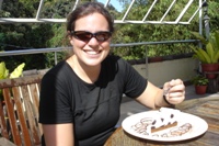 Nikki enjoying a well-earned cheesecake at the bottom of Mt Kinabalu, Sabah