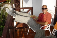 Ian relaxing on balcony at Kinabalu Rose Cabins, Sabah