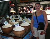 Nikki with various types of rice in the local market, Chiang Mai