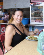 Nikki having lunch in street-side cafe, Sukhothai