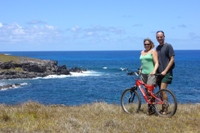 Us with bike on a brief stop on the cycle back from Tongarki, Easter Island